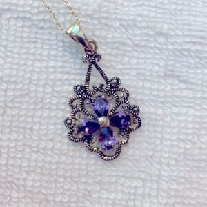 Marcasite and Amethyst pendant on sterling chain.  Beautiful purple stones.